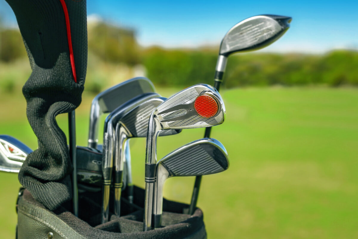 attach divot tool to golf club